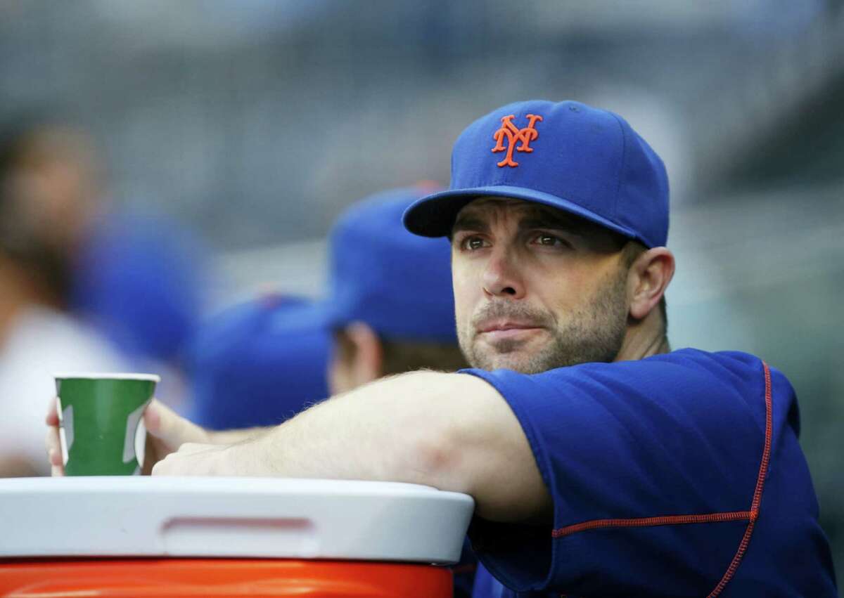 New York Mets third baseman David Wright watches from the dugout before a game last season.