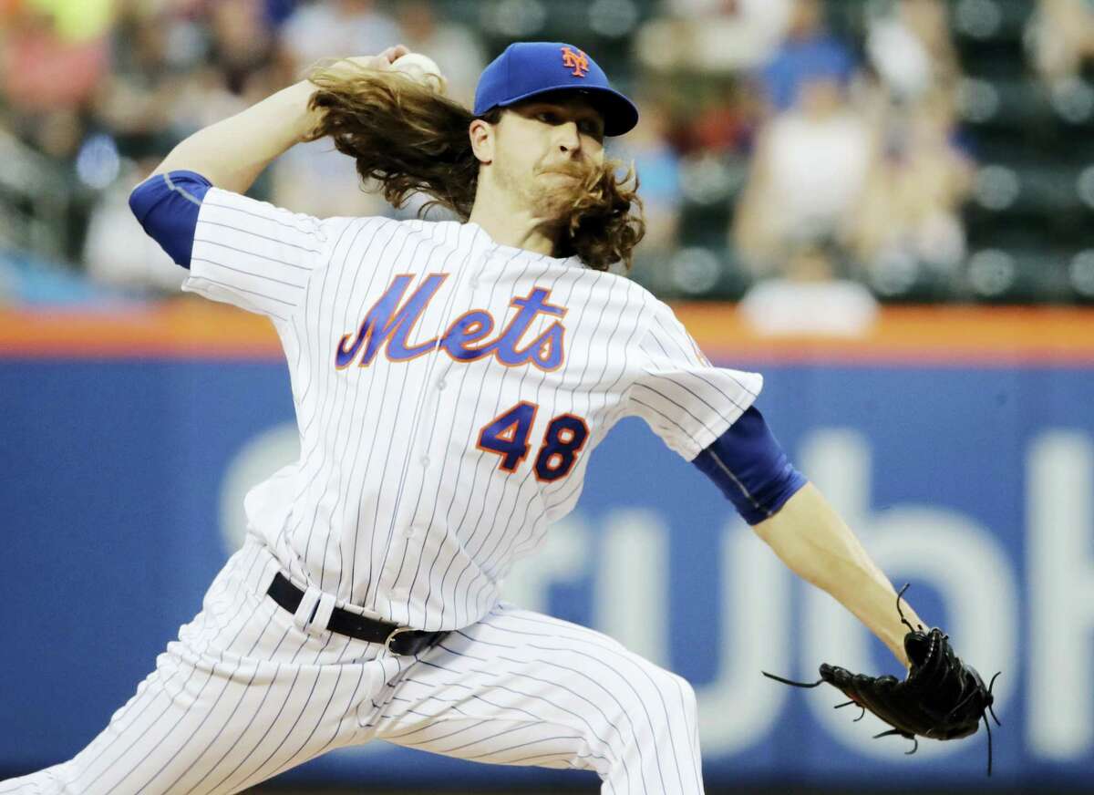 The Mets’ Jacob deGrom delivers a pitch during the first inning Friday.