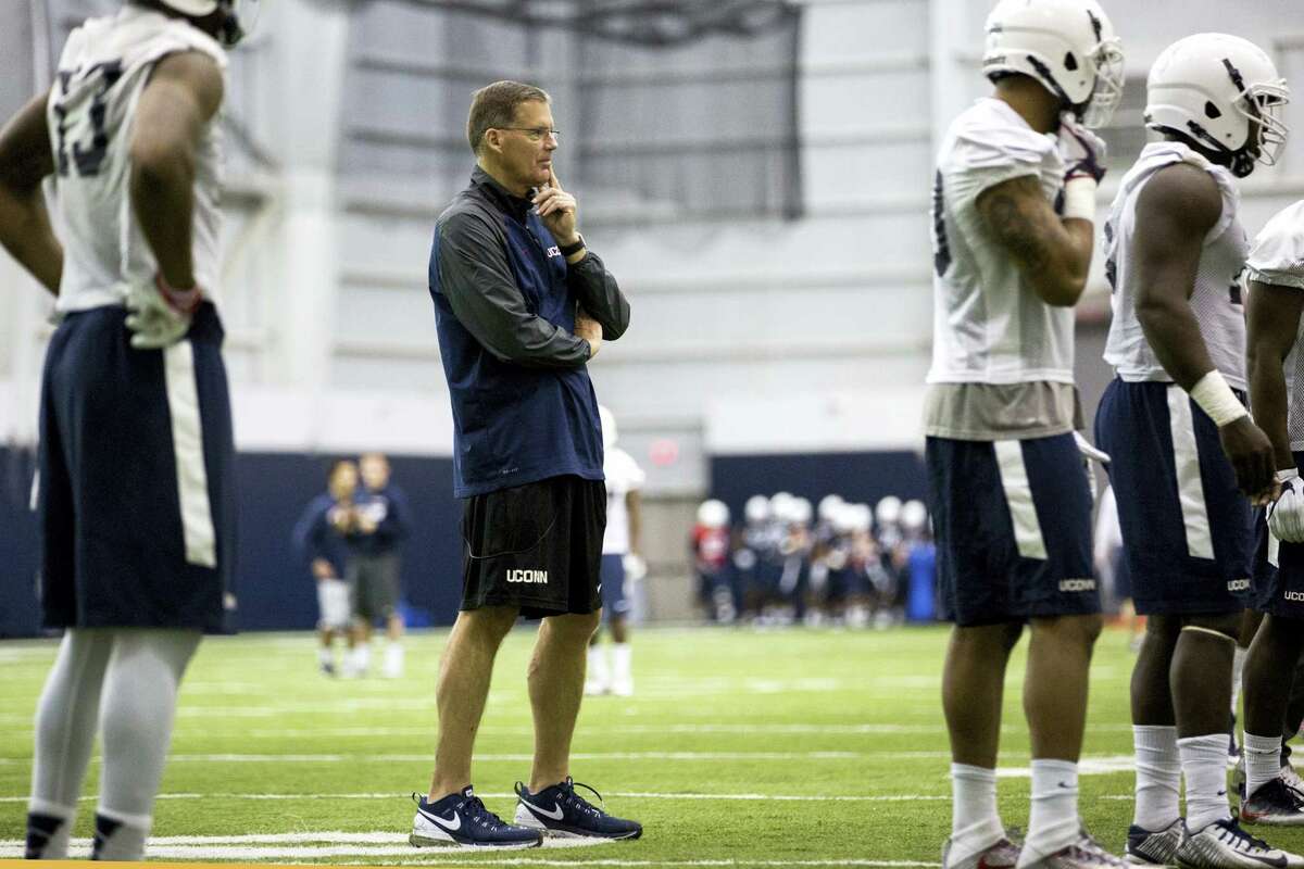 Connecticut coach Randy Edsall, center, watches during spring NCAA college football practice at the Mark R. Shenkman Training Center, Tuesday, March 21, 2017, in Storrs, Conn.