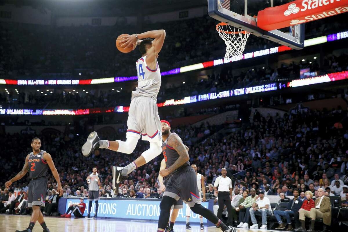 Eastern Conference small forward Giannis Antetokounmpo of the Milwaukee Bucks dunks during the first half.