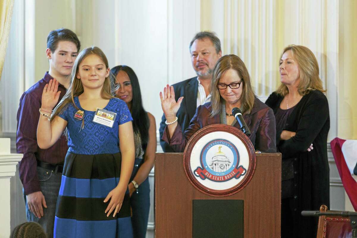 CONTRIBUTED PHOTO 2017 Connecticut’s Kid Governor Jessica Brocksom, a student at John F. Kennedy School in Milford, is sworn in Jan. 13 in Hartford by Secretary of the State Denise Merrill, with Kevin Brocksom, Jessica’s brother; Rose Castillo, a Brocksom family friend; Bogdan Kawejsza, Jessica’s uncle; and Donna Kawejsza, Jessica’s aunt.