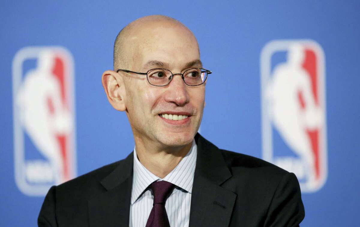 NBA Commissioner Adam Silver answers questions at a news conference after a deal was announced between the league and TV networks on Oct. 6, 2014 in New York.