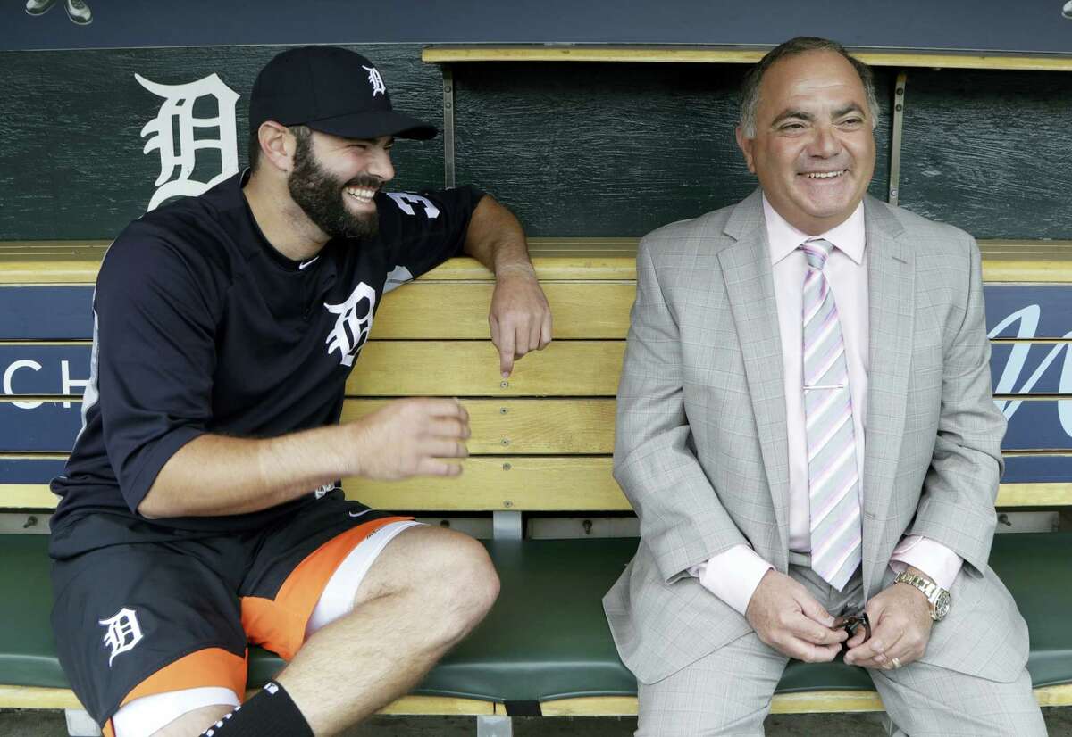 The Tigers’ Alex Avila, left, shares a laugh with his father, general manager Al Avila during an interview in Detroit.