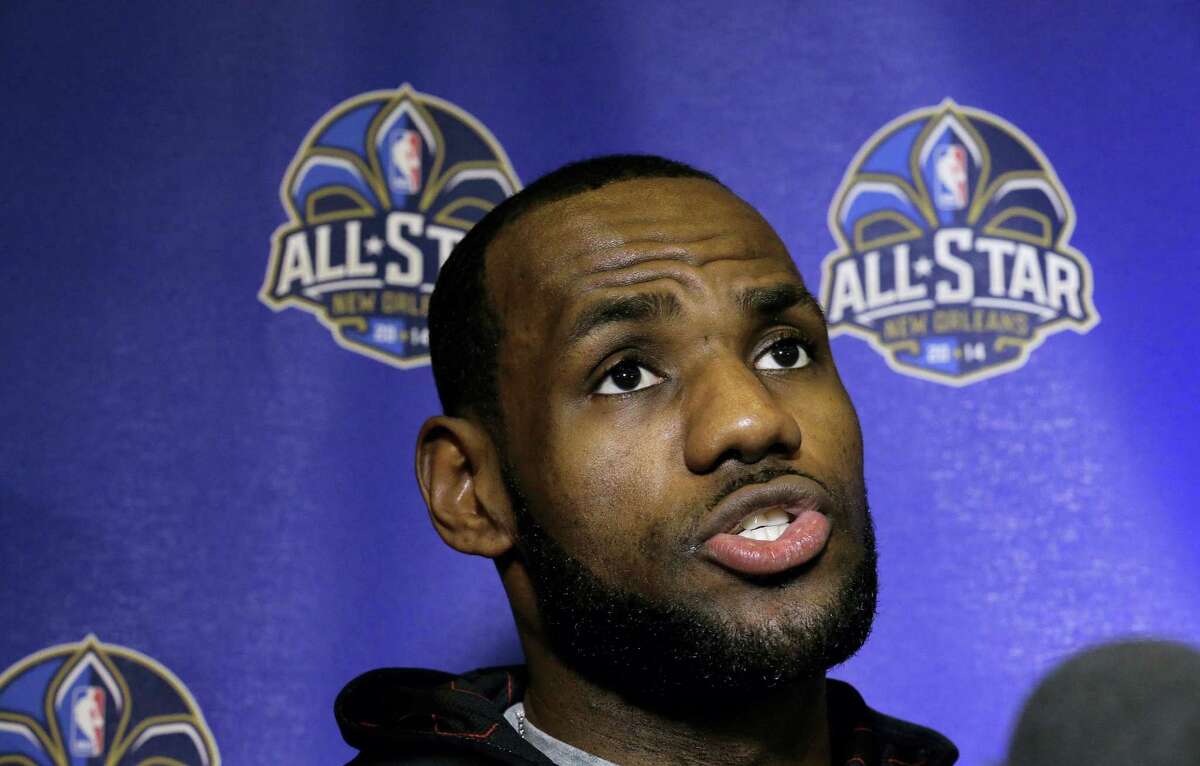 LeBron James speaks with reporters.