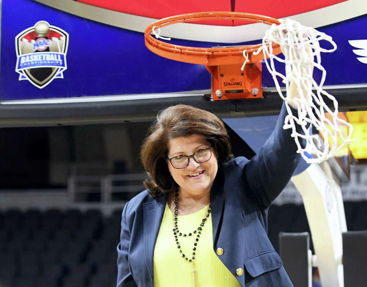 Quinnipiac head coach Tricia Fabbri cuts the net down after a 81-73 win against Rider in the NCAA college basketball championship game in the of the Metro Atlantic Athletic Conference tournament on March 6, 2017 in Albany, N.Y. Quinnipiac won.