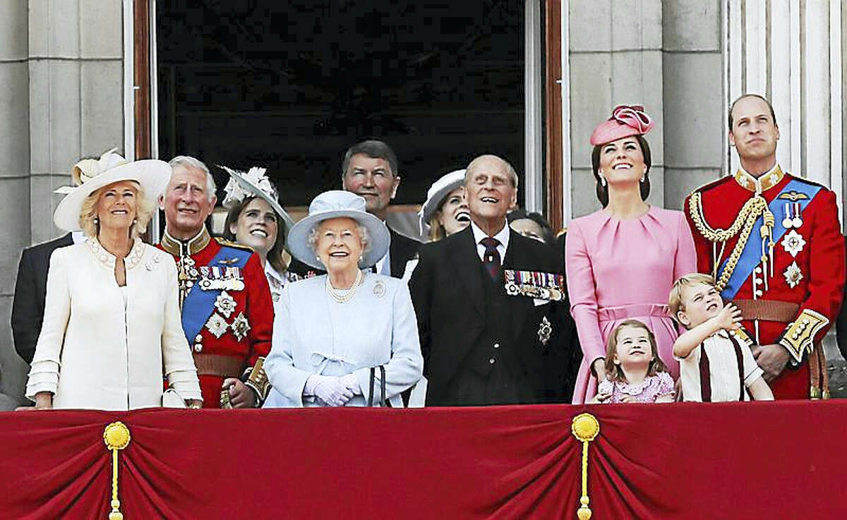 The royal family watches a “fly past” after Trooping the Color ceremony Saturday at Buckingham Palace.