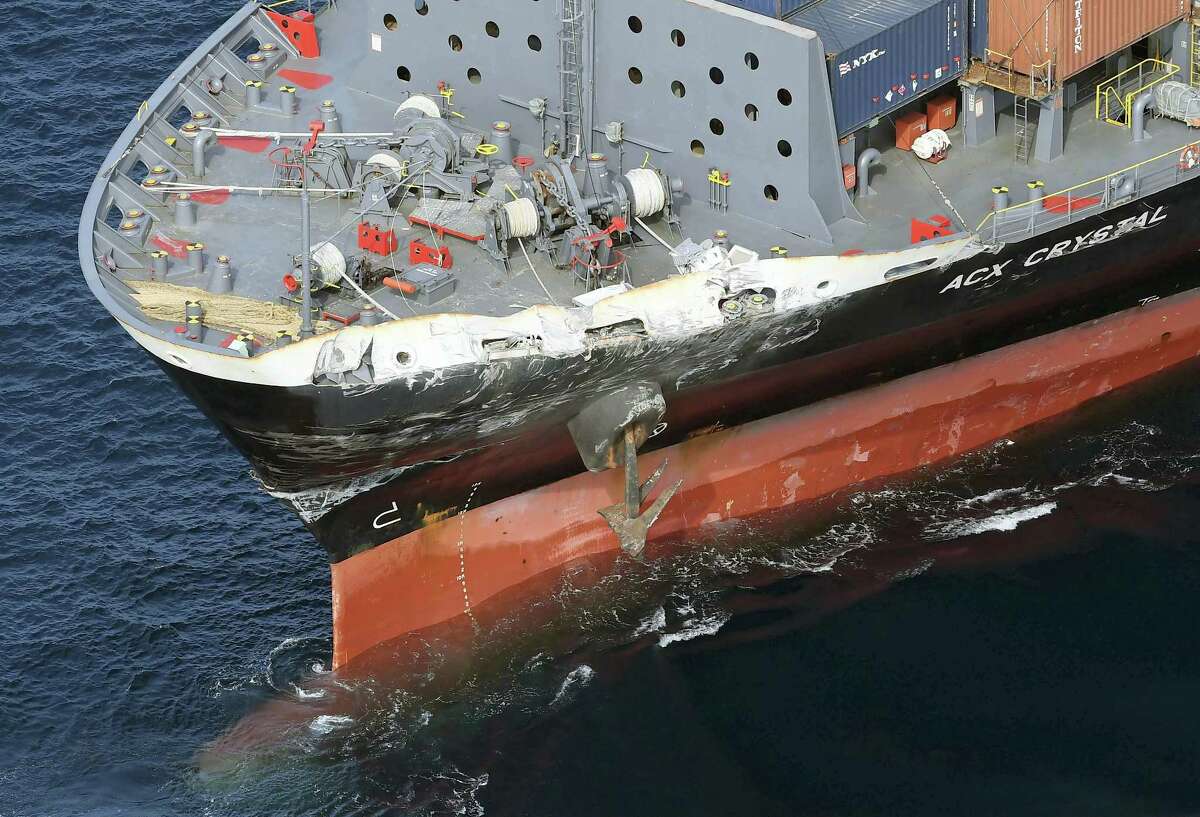 The damage of Philippine-registered container ship ACX Crystal is seen off Izu Oshima, Japan, after it collided with the USS Fitzgerald, Saturday, June 17, 2017. The Japan coast guard said it received an emergency call from a Philippine-registered container ship ACX Crystal early Saturday that it had collided with the USS Fitzgerald.