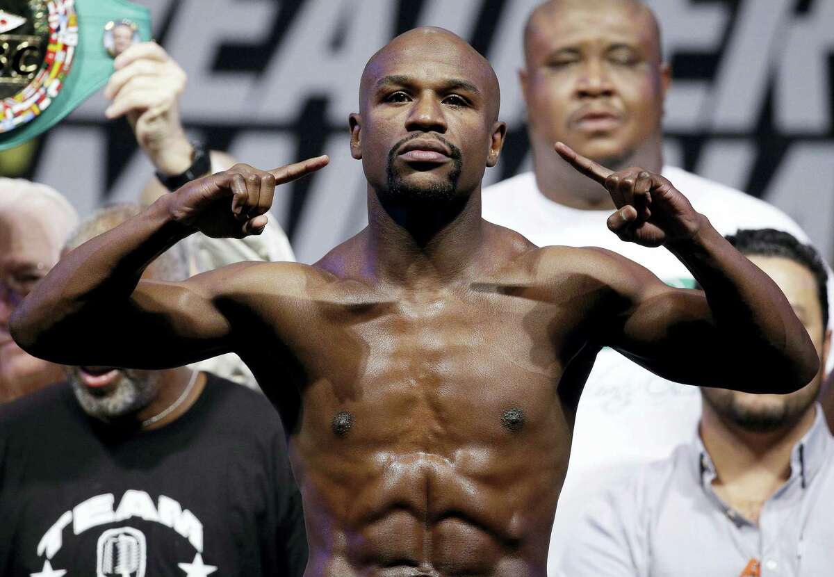 Boxer Floyd Mayweather Jr. will face UFC star Conor McGregor in a boxing match on Aug. 26.