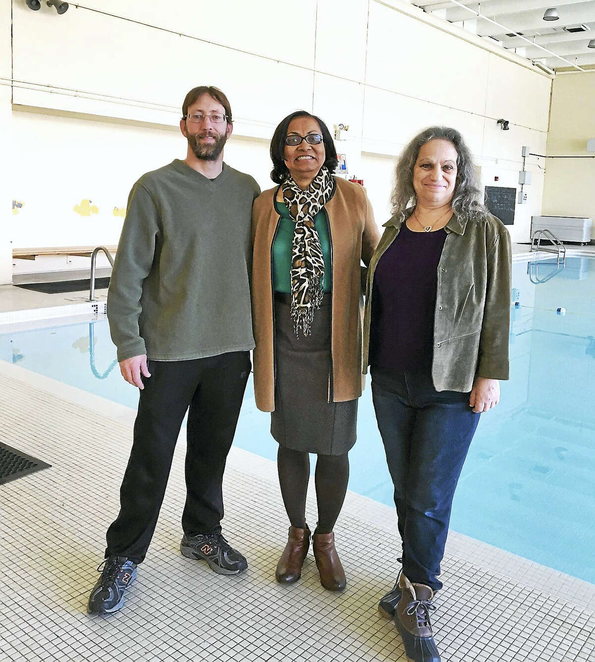 From left, Kacey Rosenfield, aquatic instructor at Conte-West Magnet School; Principal Dianne Spence and neighbor Heidi Korrick at the pool which will be opened to the public in a short trial run.
