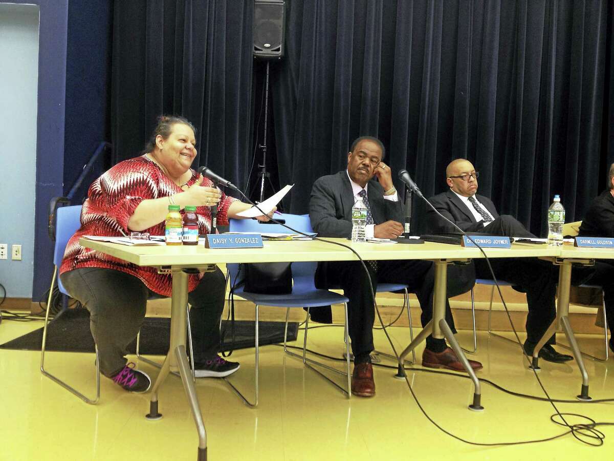 BRIAN ZAHN — NEW HAVEN REGISTER Board of Education members, from left, Daisy Gonzalez, Ed Joyner and Darnell Goldson at a meeting Monday in New Haven.