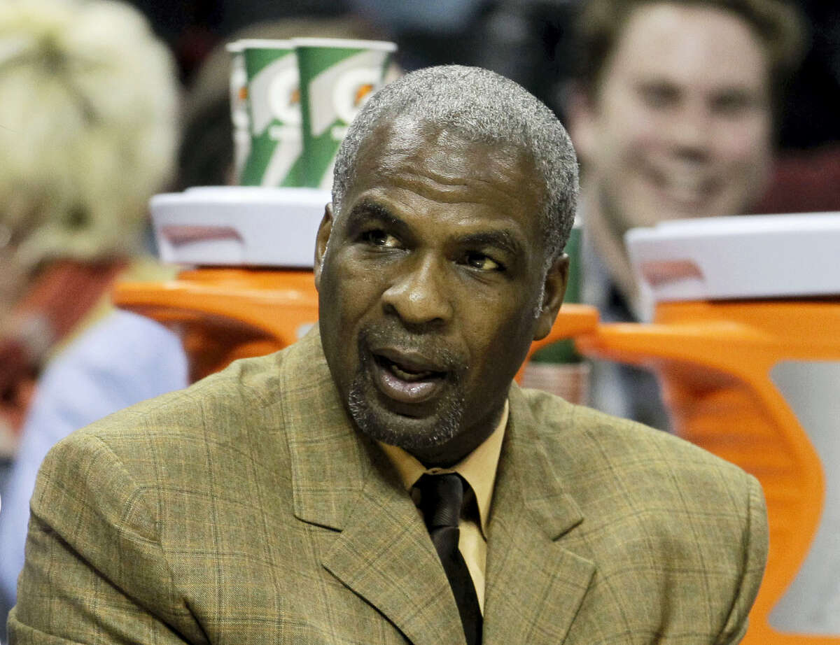 In this Jan. 20, 2011 photo, Charlotte Bobcats assistant coach Charles Oakley watches from the bench in the first half of an NBA basketball game against the Philadelphia 76ers in Charlotte, N.C. A person briefed on the discussions tells The Associated Press that Madison Square Garden has lifted its ban of Charles Oakley. The person who spoke to the AP on Tuesday, Feb. 14, 2017 on condition of anonymity because the discussions were to remain private, says the former Knicks star who was arrested at a game last week is welcome back at the arena. Madison Square Garden chairman James Dolan banned Oakley on Friday, two days after the former power forward had an altercation with security guards while attending a game.
