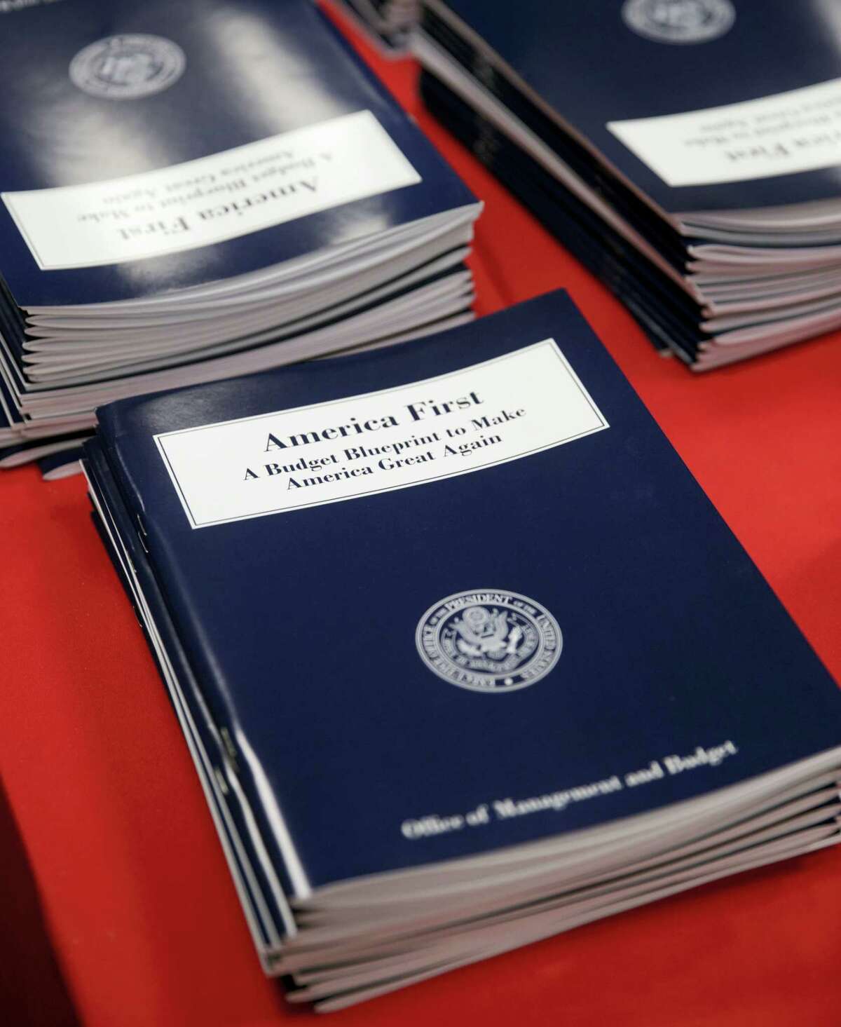 Copies of President Donald Trump’s first budget are displayed at the Government Printing Office in Washington, Thursday, March, 16, 2017. Trump unveiled a $1.15 trillion budget on Thursday, a far-reaching overhaul of federal government spending that slashes many domestic programs to finance a significant increase in the military and make a down payment on a U.S.-Mexico border wall.