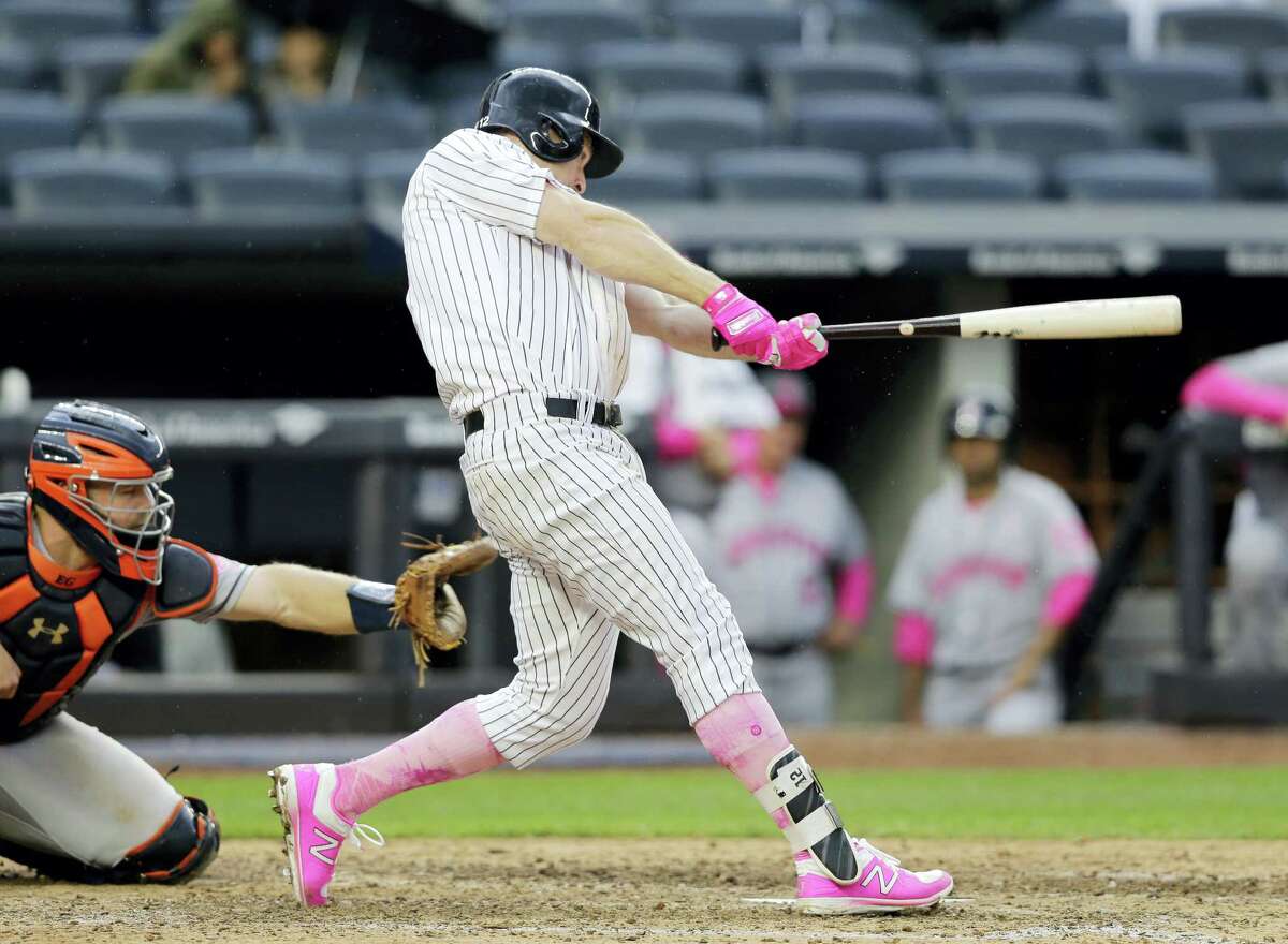 The Yankees’ Chase Headley hits a three-run home run during the seventh inning Sunday.