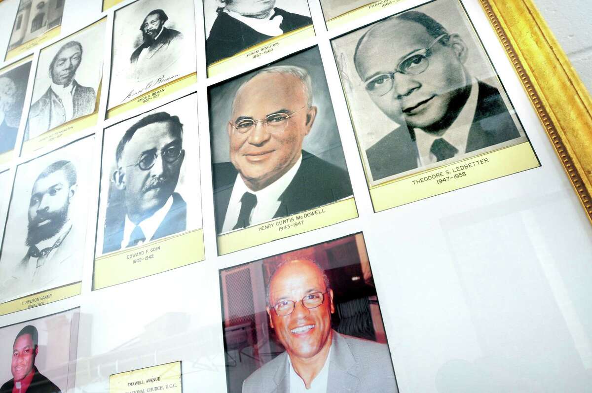 Past pastors of the Dixwell Avenue Congregational United Church of Christ in New Haven are displayed in the lobby on Feb. 12, 2014.
