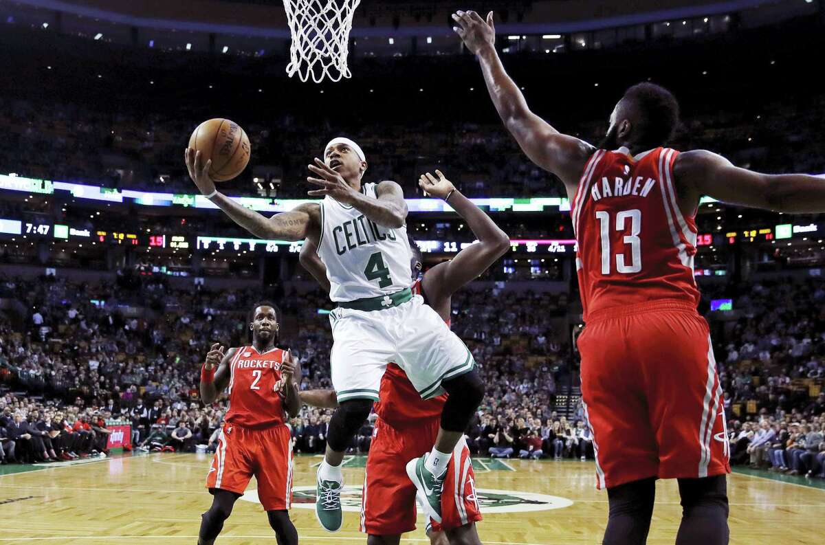 Boston Celtics guard Isaiah Thomas drives to the basket against Houston Rockets guard James Harden (13) during the first quarter in Boston, Wednesday. Thomas scored 38 points to lead the Celtics to the 120-109 victory.