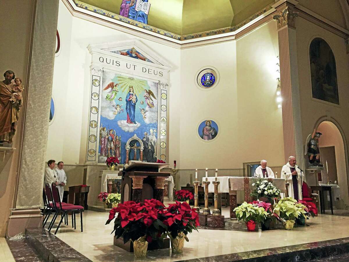 The Church of Saint Michael’s chancel during a Mass commemorating the 60th anniversary of the Franklin Street Fire Tuesday in New Haven.