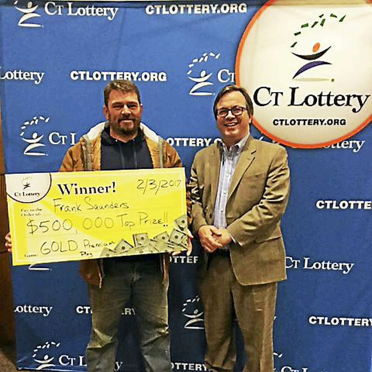 Frank Saunders of Old Saybrook claims his Gold Premium Play top prize in the Connecticut Lottery.