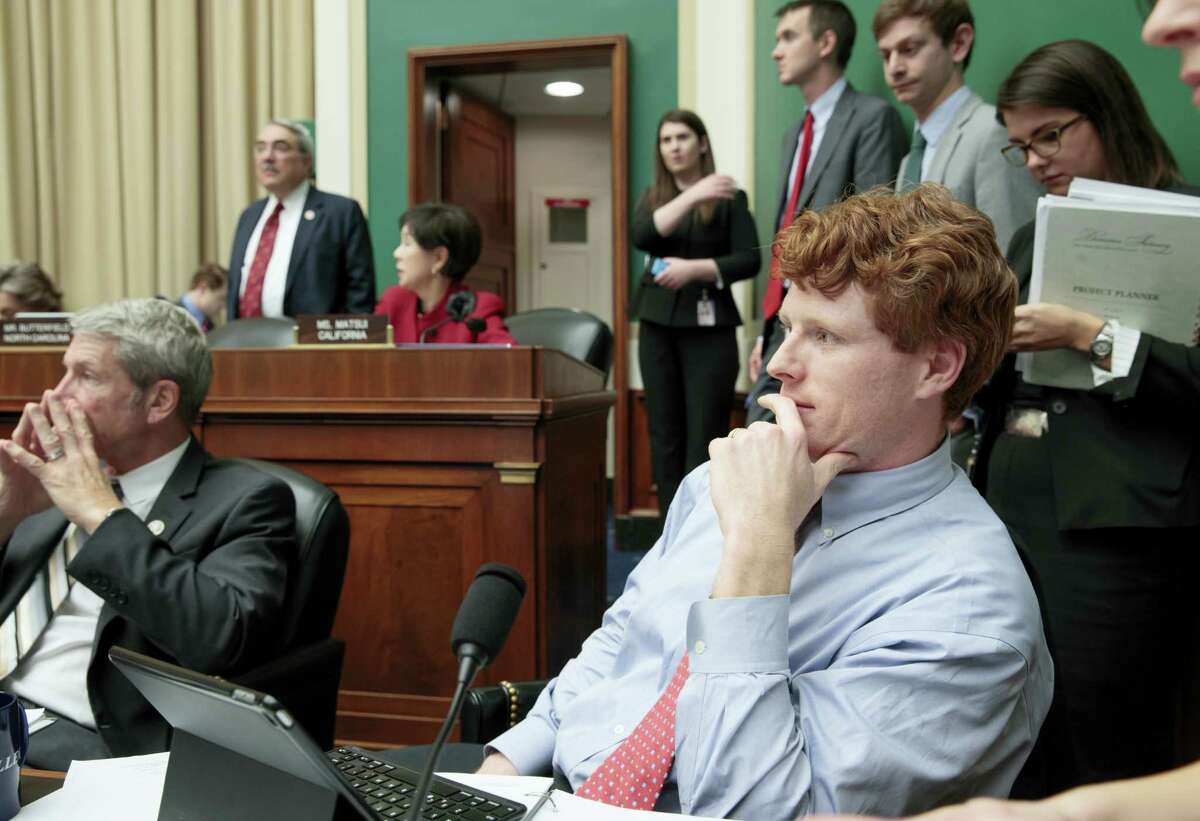 In this photo taken March 9, 2017, House Energy and Commerce Committee member Rep. Joseph P. Kennedy III, D-Mass., joined at left by Rep. Kurt Schrader, D-Ore., listens on Capitol Hill in Washington as debate continues after working through the night with members of the committee on the GOP’s “Obamacare” replacement bill. A familiar name from Massachusetts is carrying his family legacy into a new era, battling Republicans who want to undo Barack Obama’s health care law.