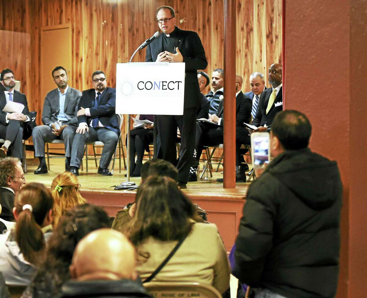 The Rev. James Manship of St. Rose of Lima Catholic Church in New Haven and the o-chairman of CONECT’s Strategy Team, speaks during a Congregations Organized for a New Connecticut (CONECT) solidarity assembly at the New Haven church Tuesday.