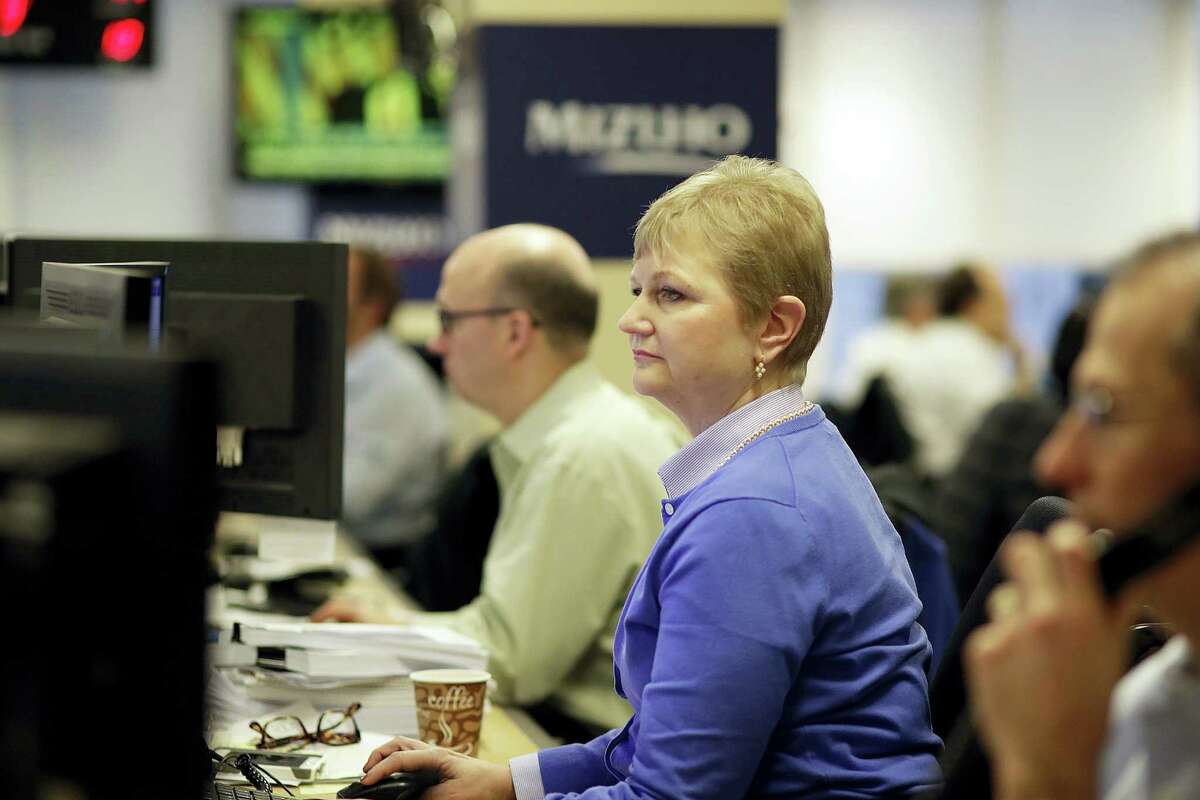 Traders work on the Mizuho Americas trading floor in New York.