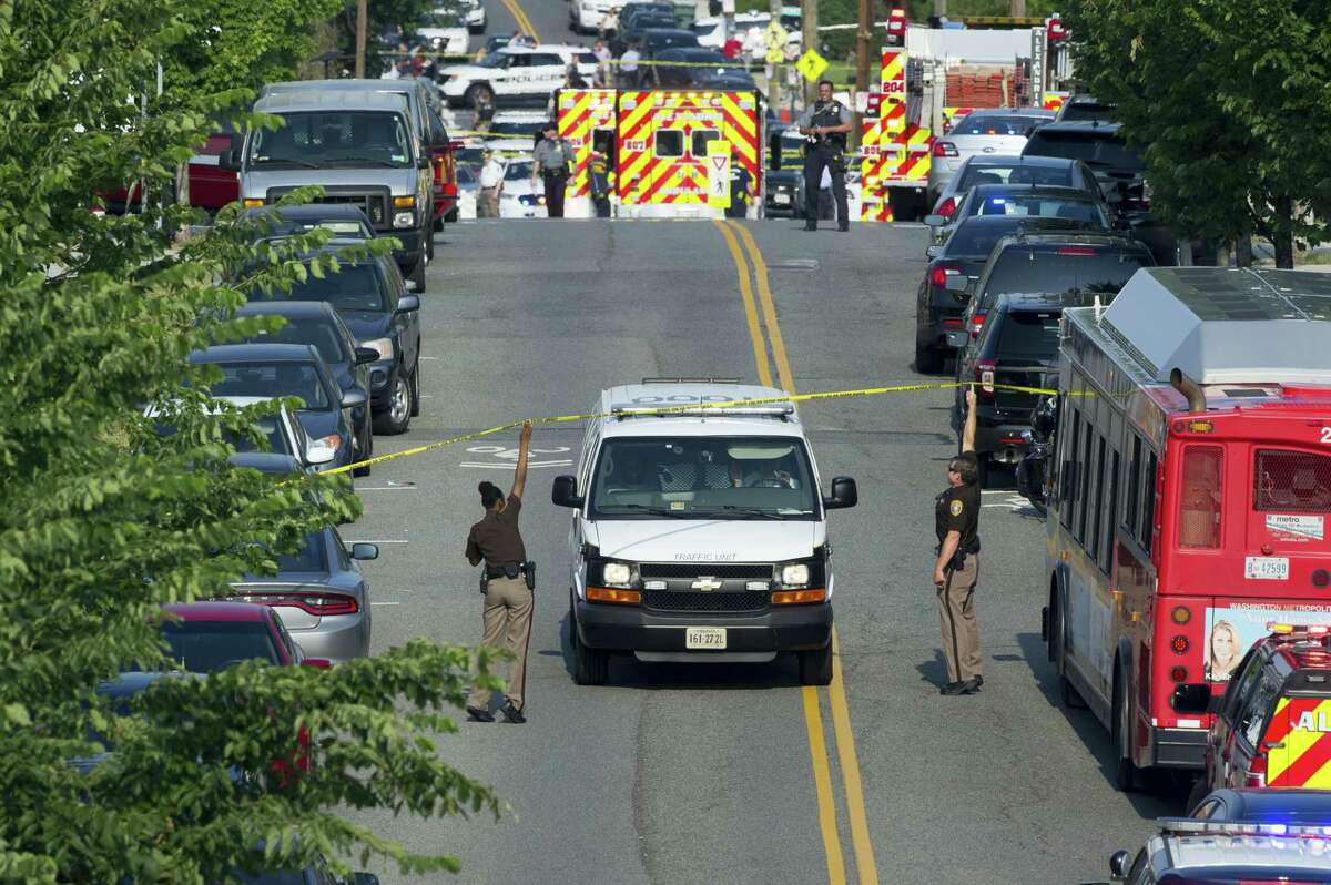Police and emergency personnel are seen near the scene where House Majority Whip Steve Scalise of La. was shot during a Congressional baseball practice in Alexandria, Va. on June 14, 2017.