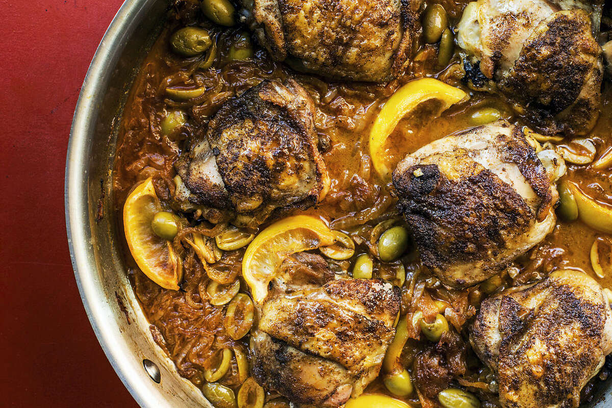 Braised chicken with green olives and onions.