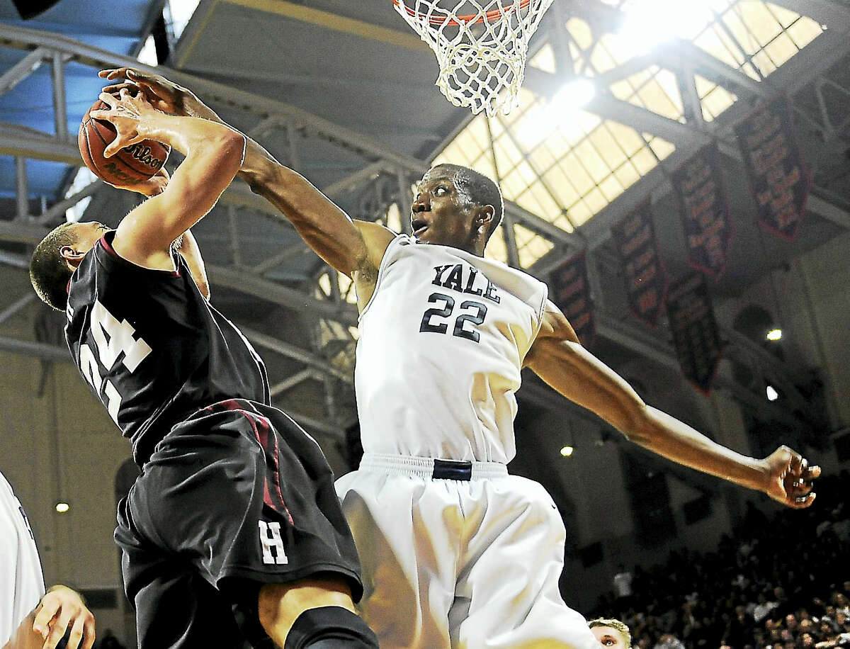 Yale’s Justin Sears (22) blocks a shot from Harvard’s Jonah Travis during an Ivy League playoff game in 2015 in Philadelphia.