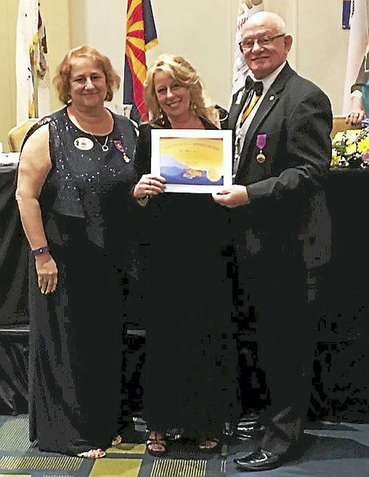 From left, Lions Club District Governor Colette Anderson, Zone Chairwoman Melissa A. Smith and International Director N. Alan Lundgre.