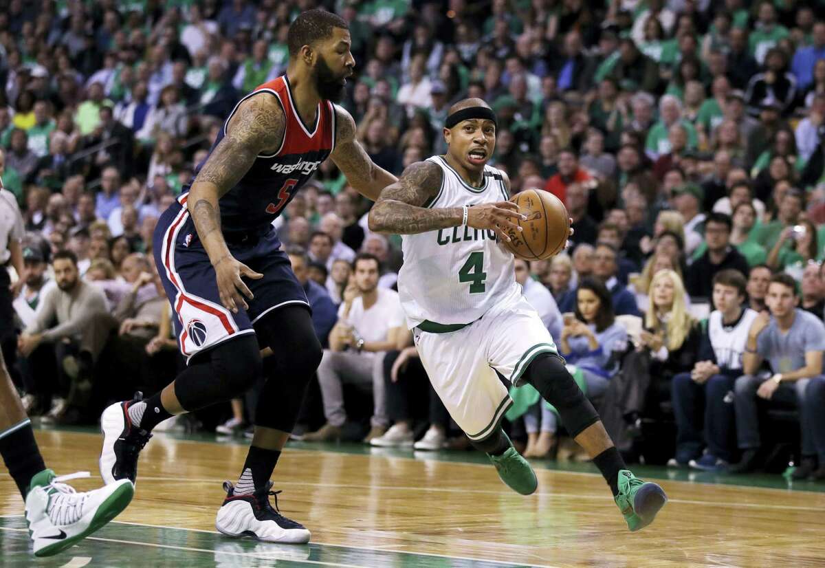 Boston Celtics guard Isaiah Thomas drives to the basket past Washington Wizards forward Markieff Morris during the second quarter of Game 5 of an NBA basketball second-round playoff series in Boston Wednesday. The Celtics won 123-101.
