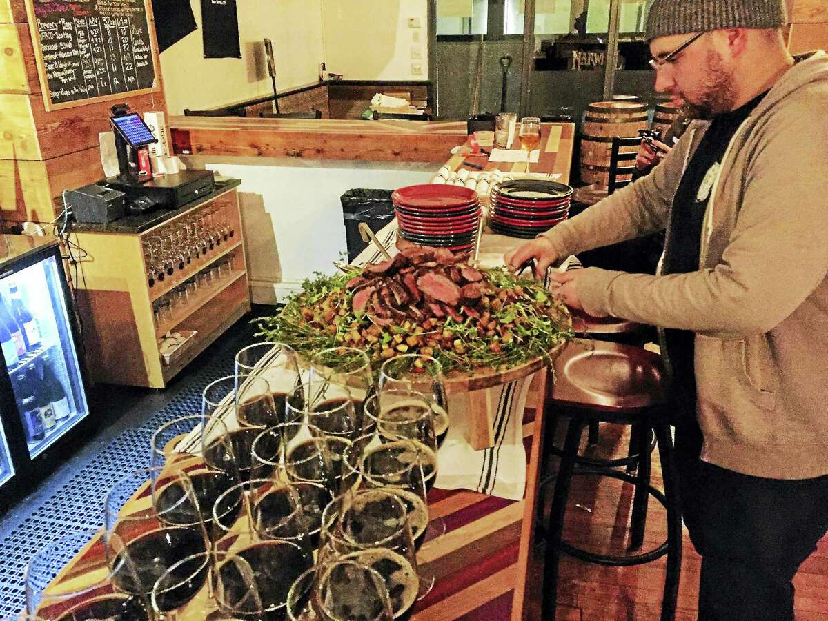 Co-owner Craig Sklar puts out food during a seminar at The Beer Collective. In Connecticut, other breweries and bars have also suffered due to the ongoing pandemic. Earlier this month, Skygazer Brewing Co. in Southington announced a break from brewing after their co-owner and head brewer left the company. In March, Hanging Hills Brewery in Hartford was the first brewery to announce its closure as a result of the coronavirus pandemic.