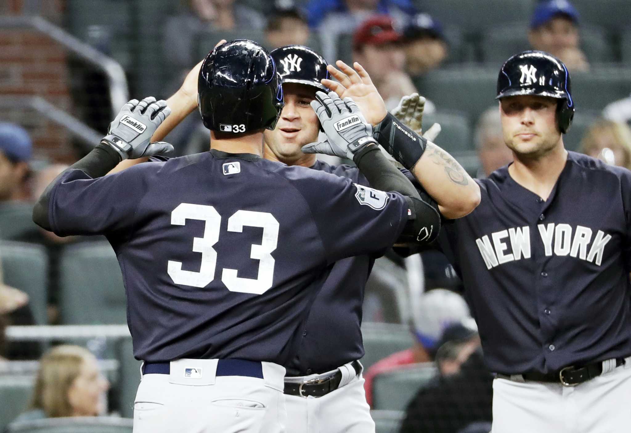 New York Yankees' Greg Bird, right, celebrates with Gary Sanchez