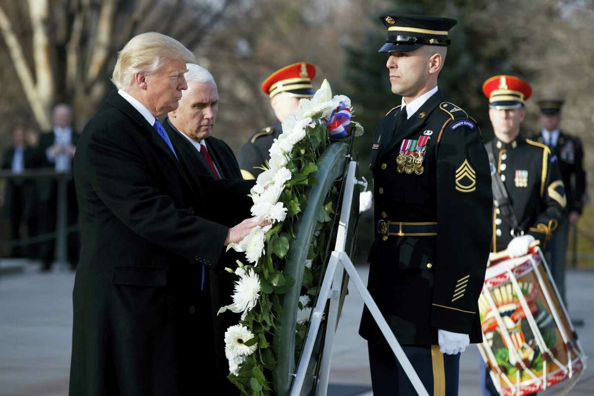 President-elect Donald Trump, accompanied by Vice President-elect Mike Pence, places a wreath at the Tomb of the Unknowns Thursday at Arlington National Cemetery in Arlington, Va., ahead of today’s presidential inauguration.