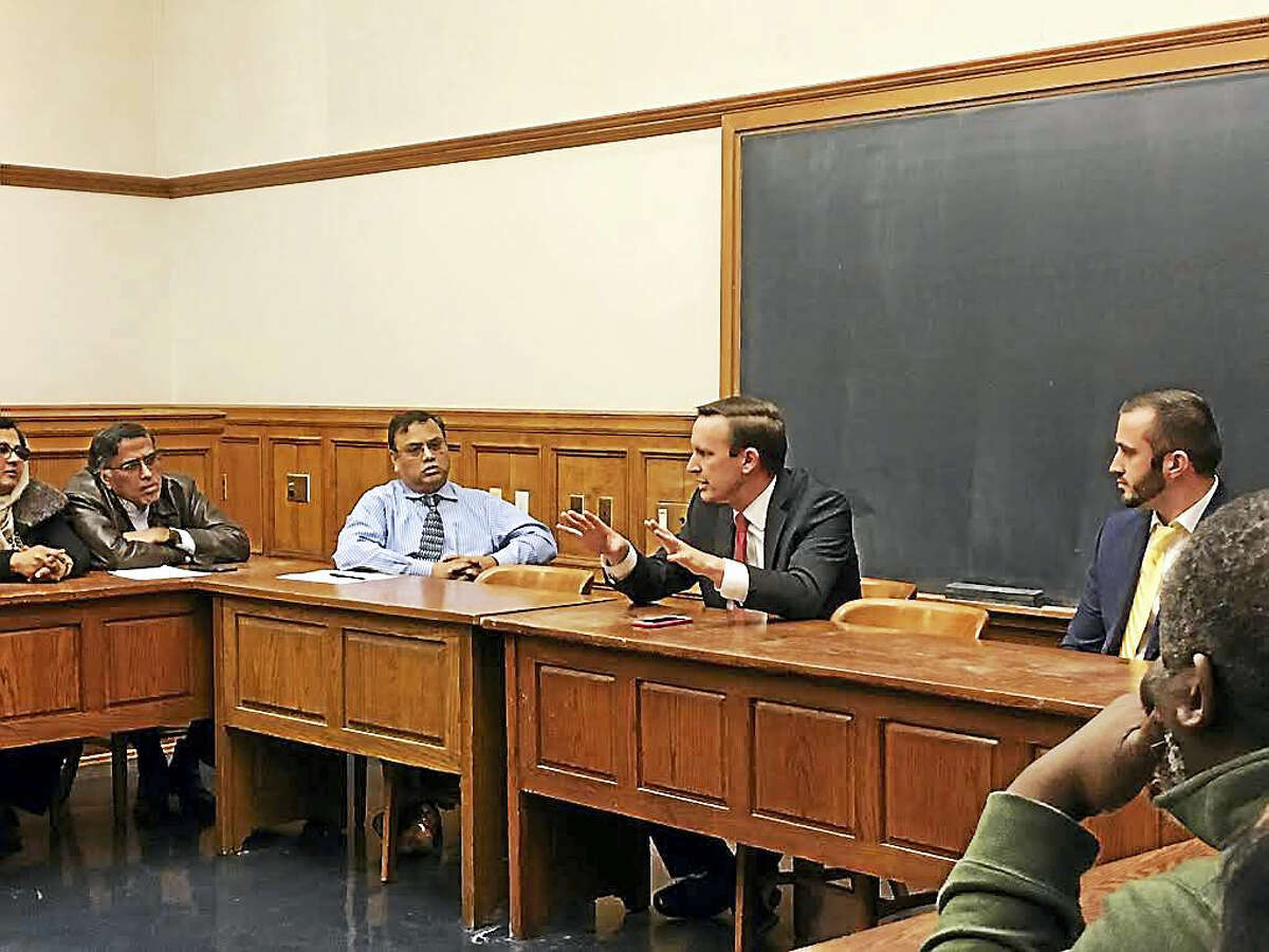 U.S. Sen. Chris Murphy, center, speaks Tuesday with Connecticut Muslim leaders at the Yale Law School.