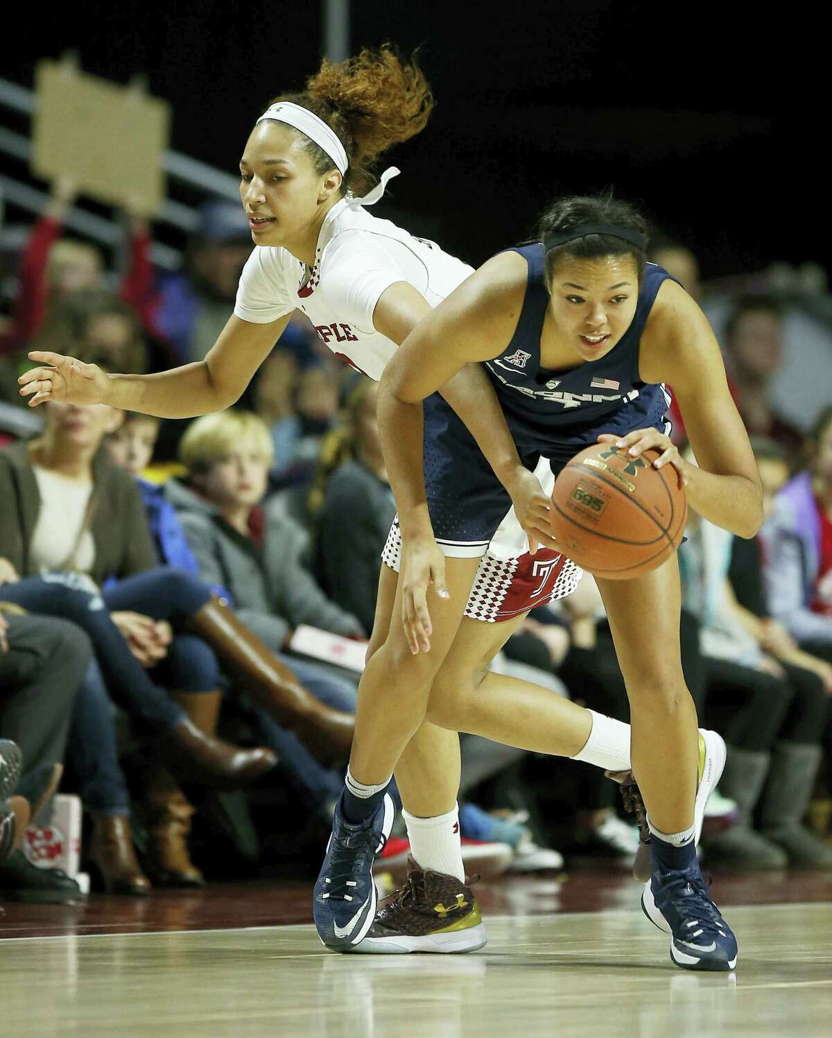 UConn forward Napheesa Collier steals the basketball from Temple forward Ruth Sherrill during Wednesday’s game.