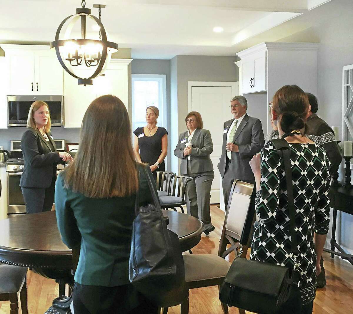 State and local lawmakers as well as representatives from Energize Connecticut, Home Builders and Remodelers Association and the Green Building Council were on hand to tour Connecticut’s First Zero Energy subdivision, Singer Village in Derby.