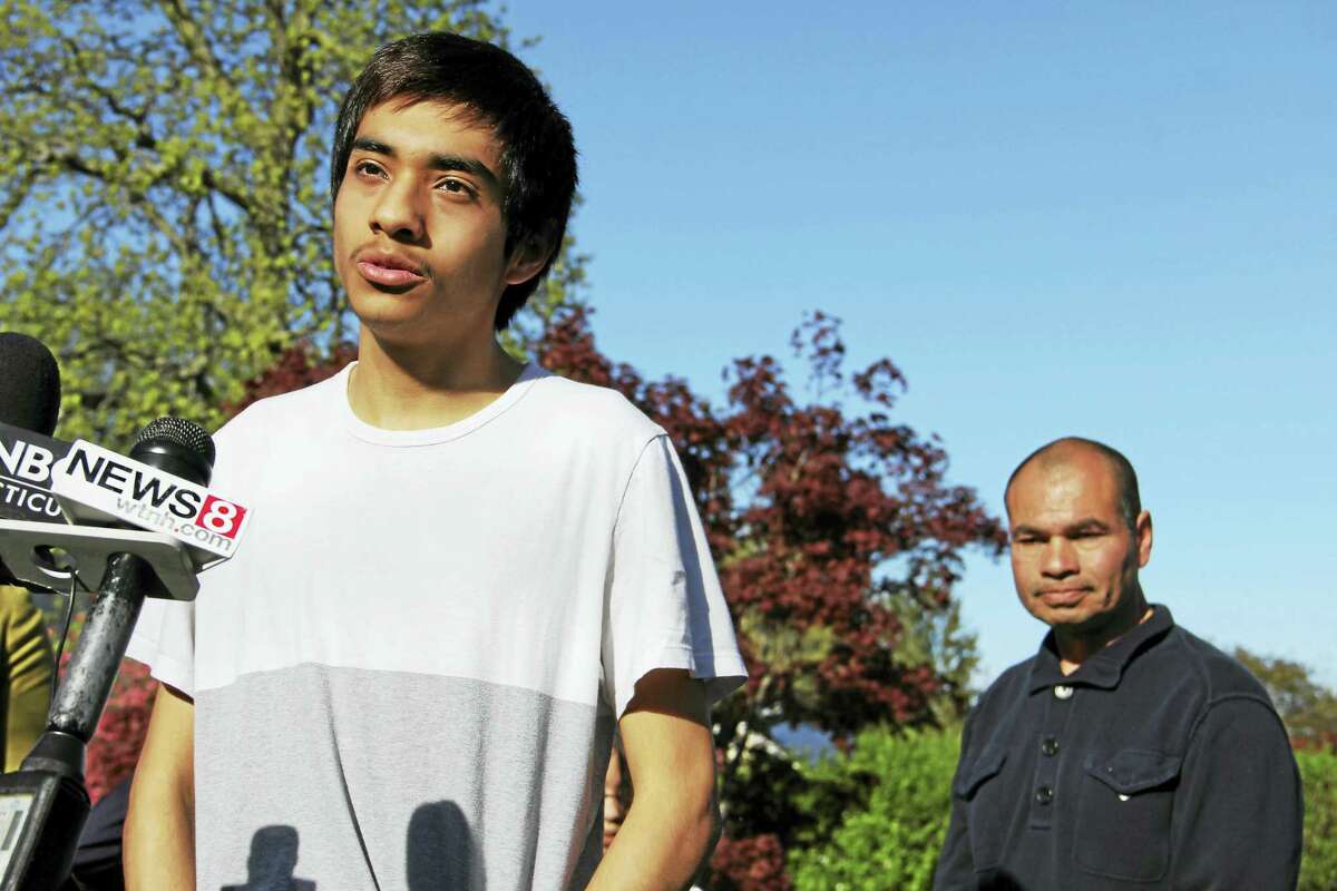 Lester Barrios speaks during a press conference outside his home while his father, Luis, looks on in the background on Wednesday, May 3, in Derby. Esteban L. Hernandez New Haven Register