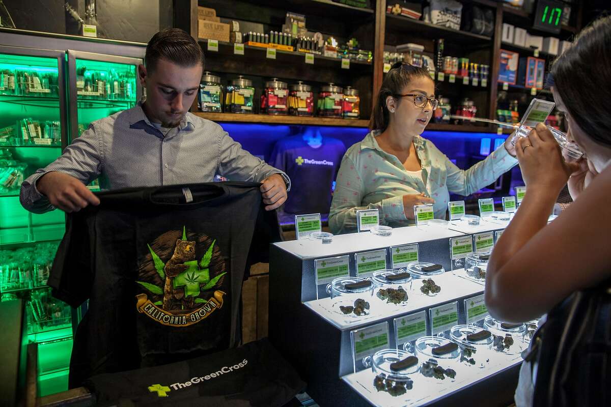 Green Cross cannabis dispensary merchandise, t-shirts that display the Green Cross logo, may too be illegal to sell if a state bill is passed banning pot shops from selling t-shirts and other merchandise with their store name on it -- in order to protect children from cannabis marketing, in San Francisco, California, USA 22 Jul 2017. (Peter DaSilva/Special to The Chronicle)