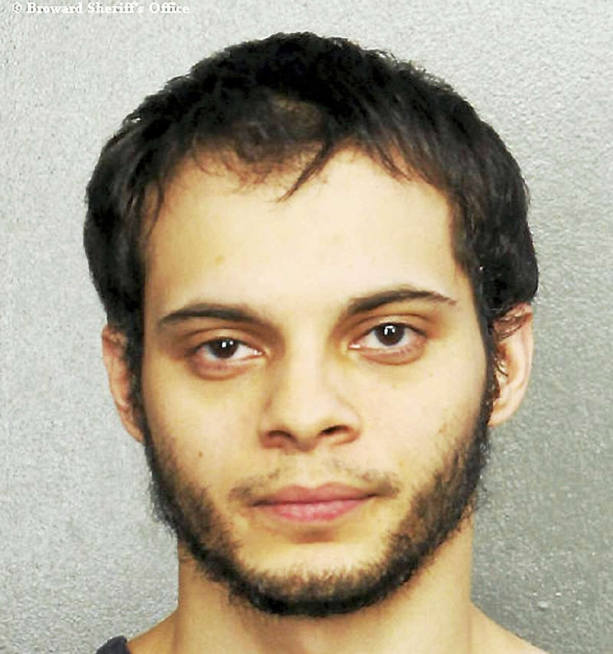 This booking photo provided by the Broward Sheriff’s Office shows suspect Esteban Ruiz Santiago, 26, Saturday, Jan. 7, 2017, in Fort Lauderdale, Fla. Relatives of the man who police say opened fire Friday killing several people and wounding others at a Florida airport report he had a history of mental health issues. They tell The Associated Press and other news outlets that some of the problems followed his time serving a military tour in Iraq, and that he was being treated at his current home in Alaska.