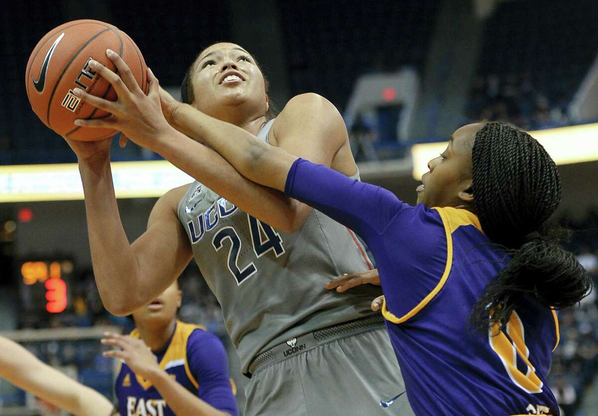 UConn’s Napheesa Collier is fouled by East Carolina’s Justice Gee, right, in the first half of UConn’s 89th consecutive victory Wednesday night, 90-45 over East Carolina.