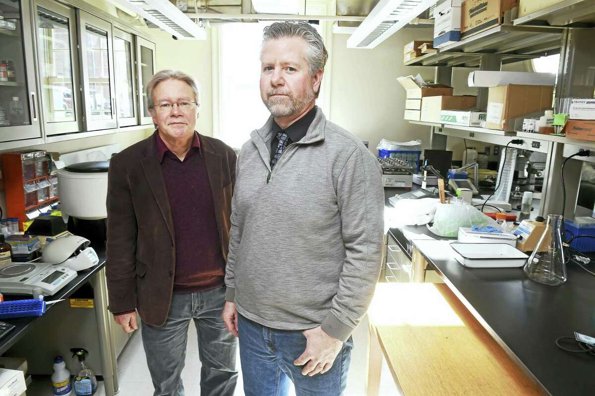 Arnold Gold — New Haven Register Wade Elmer, left, and Jason White in Elmer’s lab at the Connecticut Agricultural Experiment Station.