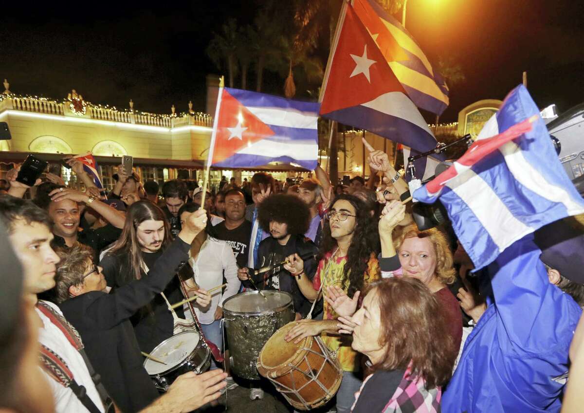 Cuban-Americans celebrate the death of Fidel Castro, Saturday, Nov. 26, 2016, in the Little Havana area in Miami. Castro died eight years after ill health forced him to formally hand power over to his younger brother Raul, who announced his death late Friday, Nov. 25, on state television.