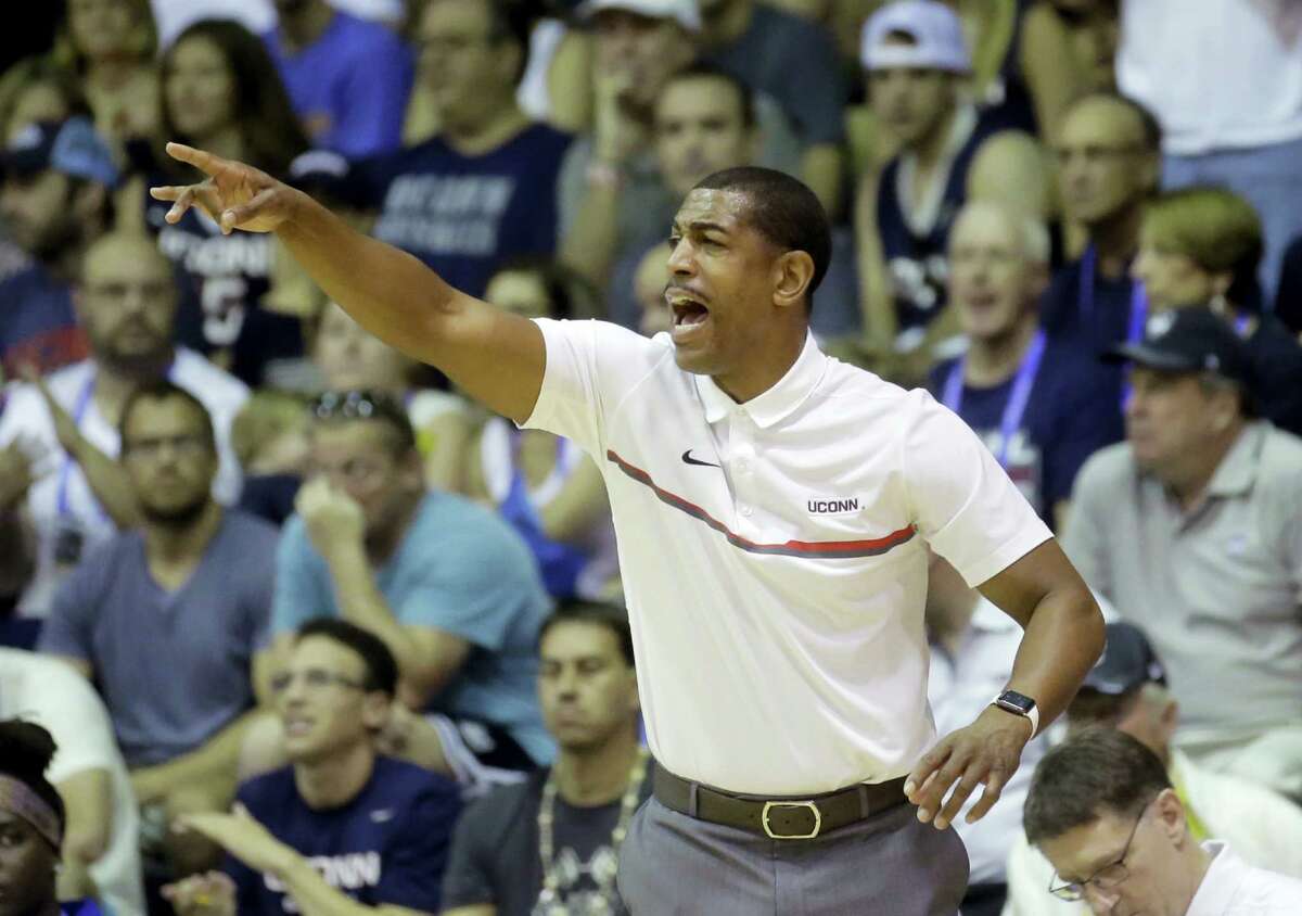 Connecticut head coach Kevin Ollie shouts to his team in the first half during an NCAA college basketball game against Oregon in the Maui Invitational Wednesday, Nov. 23, 2016, in Lahaina, Hawaii. (AP Photo/Rick Bowmer)