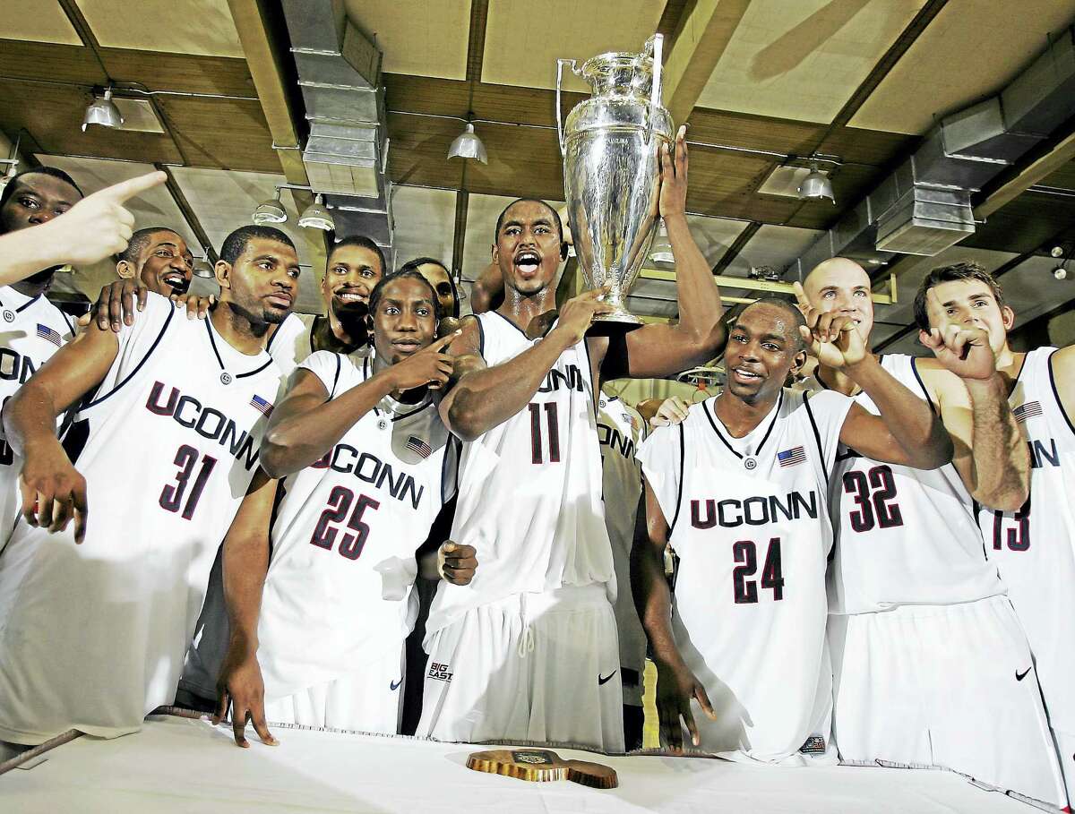 UConn players, from left, Rashad Anderson, Rob Garrison, Hilton Armstrong, Craig Austrie, Ed Nelson, and Ryan Thompson celebrate with the championship trophy after defeating Gonzaga in the 2005 Maui Invitational in Lahaina, Hawaii.