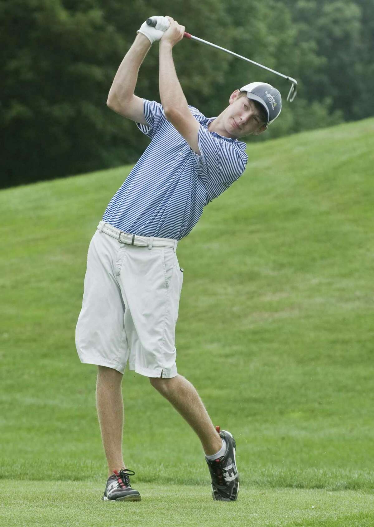 Spencer Olson watches his drive on the second day of the 27th Annual Danbury Amateur golf tournament at Richter Park. Sunday, July 23, 2017