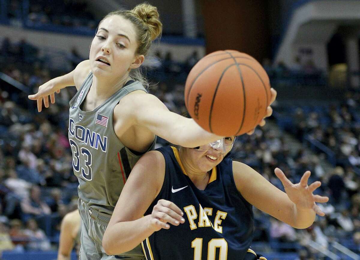 Connecticut's Katie Lou Samuelson, left, reaches beyond Pace's Gabriella Rubin to grab a rebound in the second half of a preseason NCAA college basketball game, Sunday, Nov. 6, 2016, in Hartford, Conn. (AP Photo/Jessica Hill)