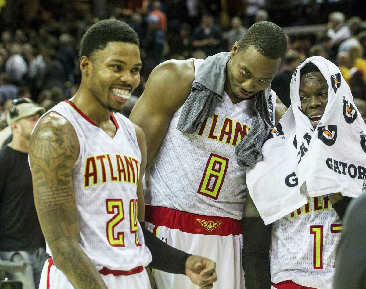 Atlanta Hawks’ Kent Bazemore (24), Dwight Howard (8), and Dennis Schroder, right, fool around after defeating the Cleveland Cavaliers in an NBA basketball game in Cleveland on Tuesday, Nov. 8, 2016.