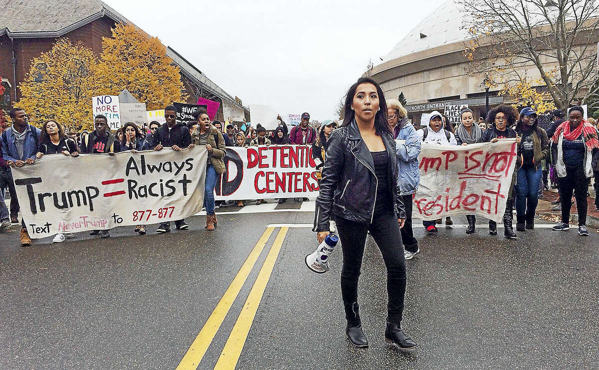 Joseline Tlacomulco leads a march on the University of Connecticut campus Wednesday in Storrs protesting the election of Donald Trump as president. Tlacomulco, a sophomore who lives in New Haven, said she was born in Mexico and came with her family to Connecticut when she was 8 months old. She fears her family may face deportation under a Trump administration.