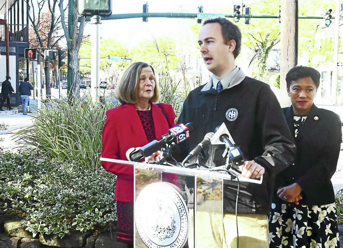 City Engineer Giovanni Zinn, center, flanked by Mayor Toni N. Harp, right, and state Rep. Patricia Dillon, speaks during a press conference Monday formally launching the new Whalley Avenue traffic calming project in New Haven.