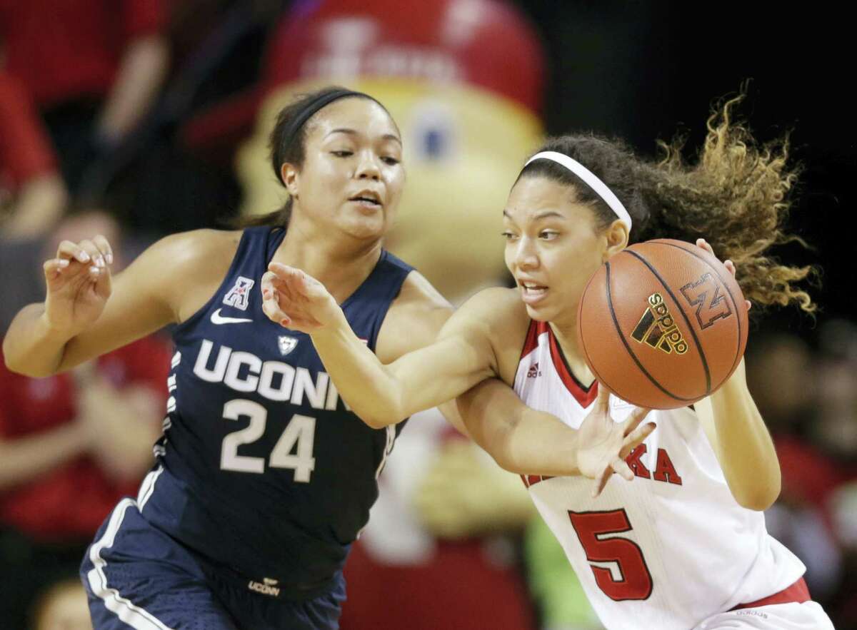 Nebraska’s Nicea Eliely (5) is defended by UConn’s Napheesa Collier (24) during the first half of action Wednesday.