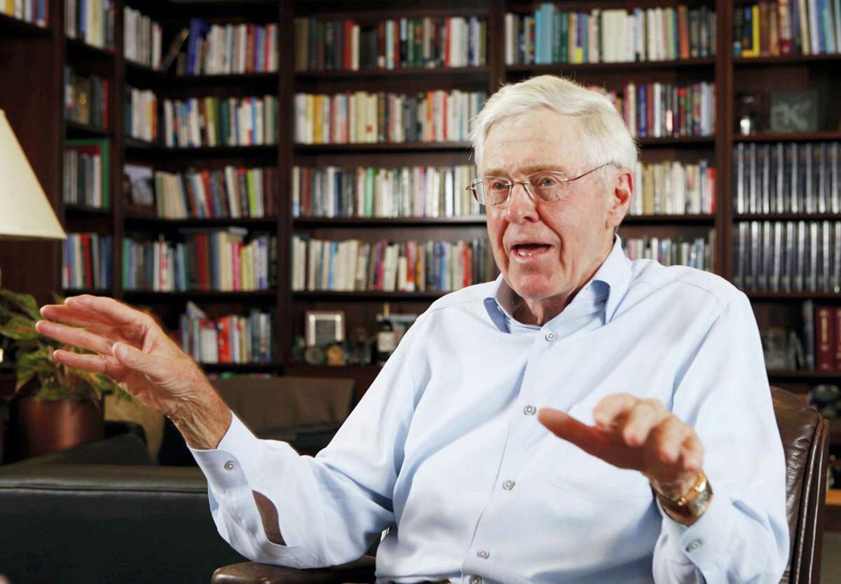 In this photo May 22, 2012 photo, Charles Koch speaks in his office at Koch Industries in Wichita, Kansas. Billionaire industrialist and conservative benefactor Koch is hosting hundreds of the nation’s most powerful political donors this weekend in Colorado.